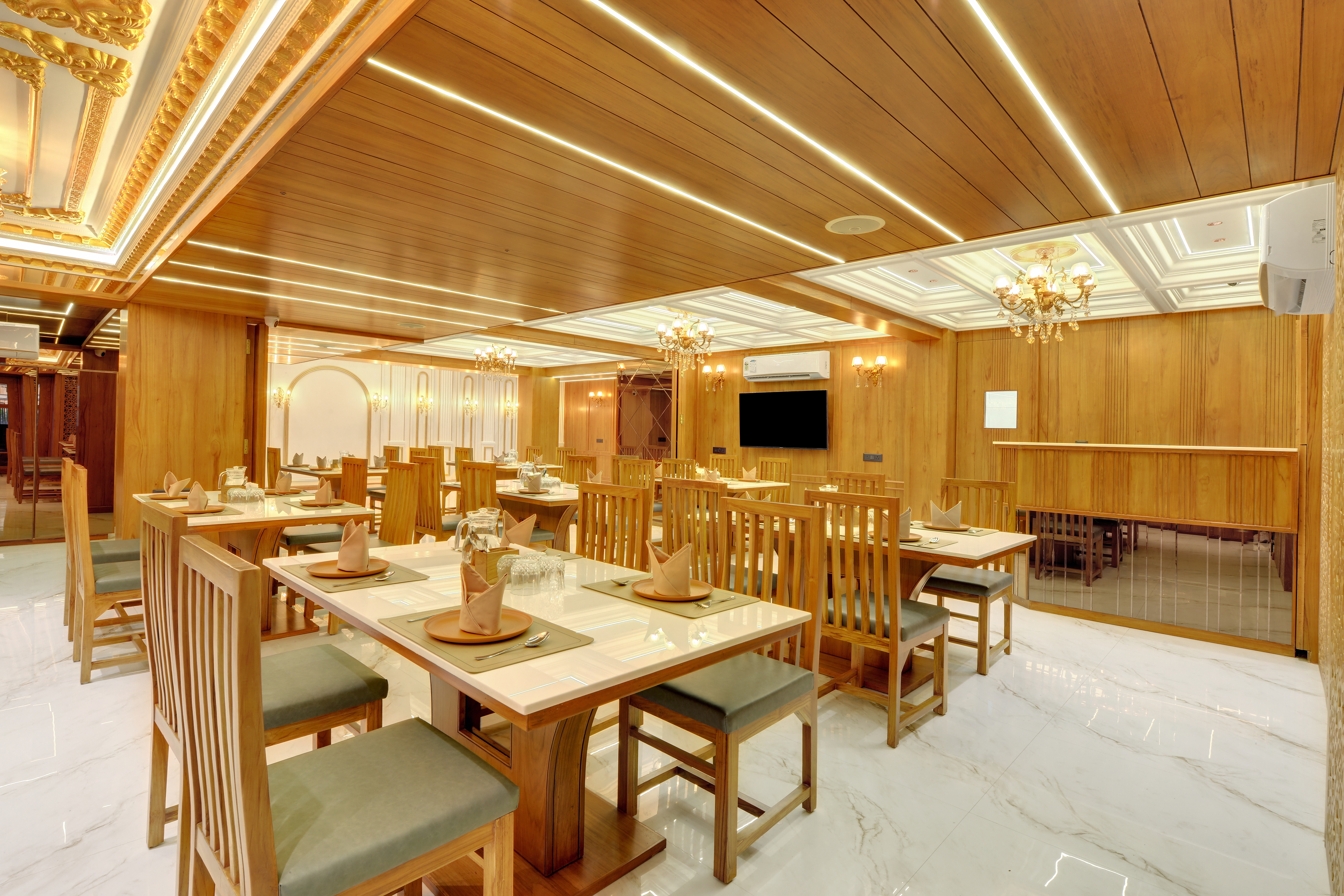 Hotel Shital Inn restaurant dining area with tables and guest seating